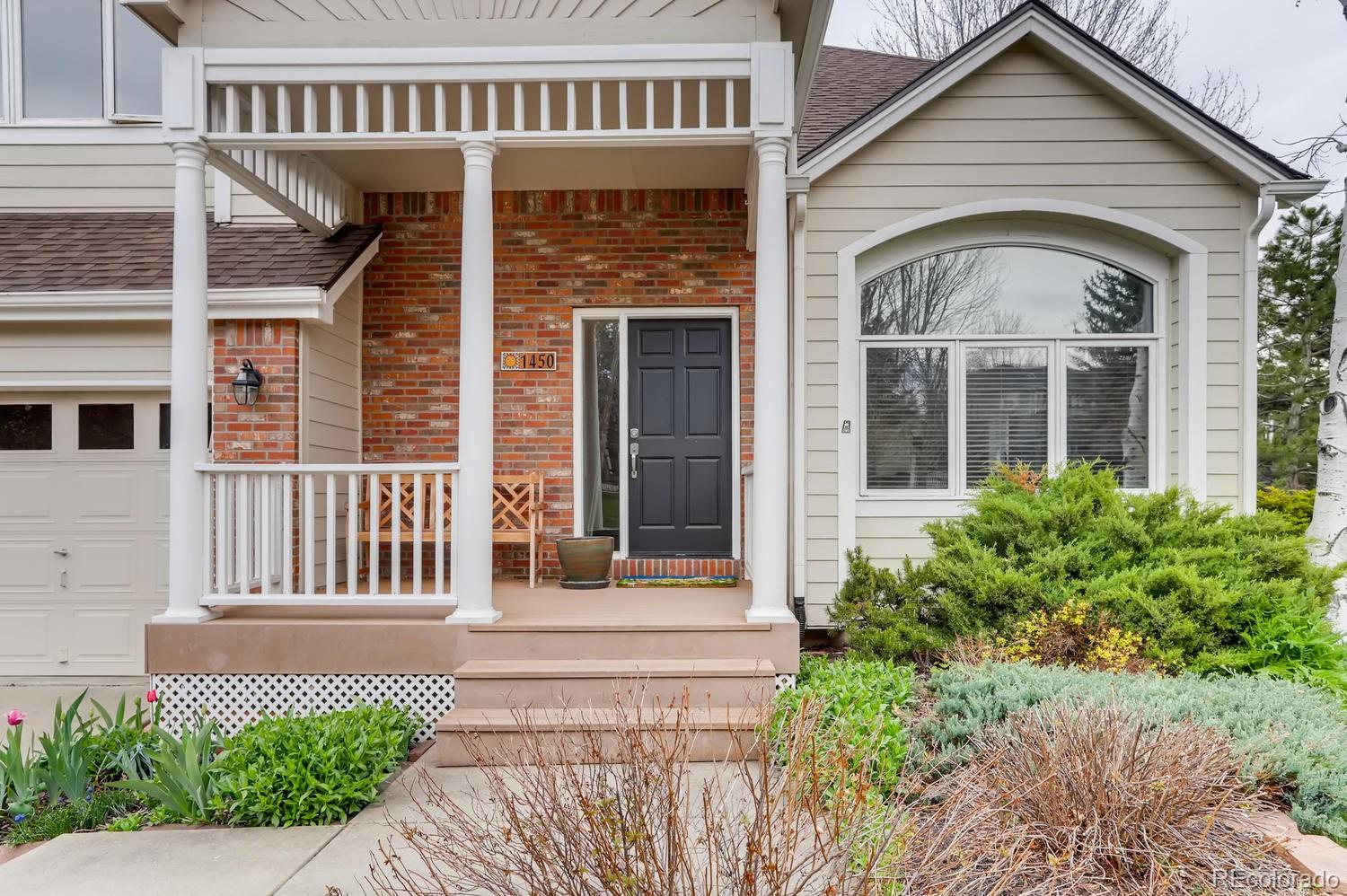 1450 Oakleaf Circle Boulder, CO 80304 - Photo 3 of 27 a front view of a house with a garden