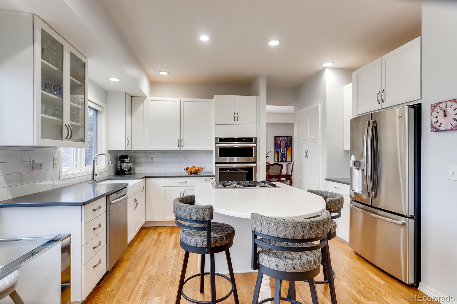 1450 Oakleaf Circle Boulder, CO 80304 - Photo 6 of 27 a kitchen with stainless steel appliances a refrigerator stove microwave and cabinets