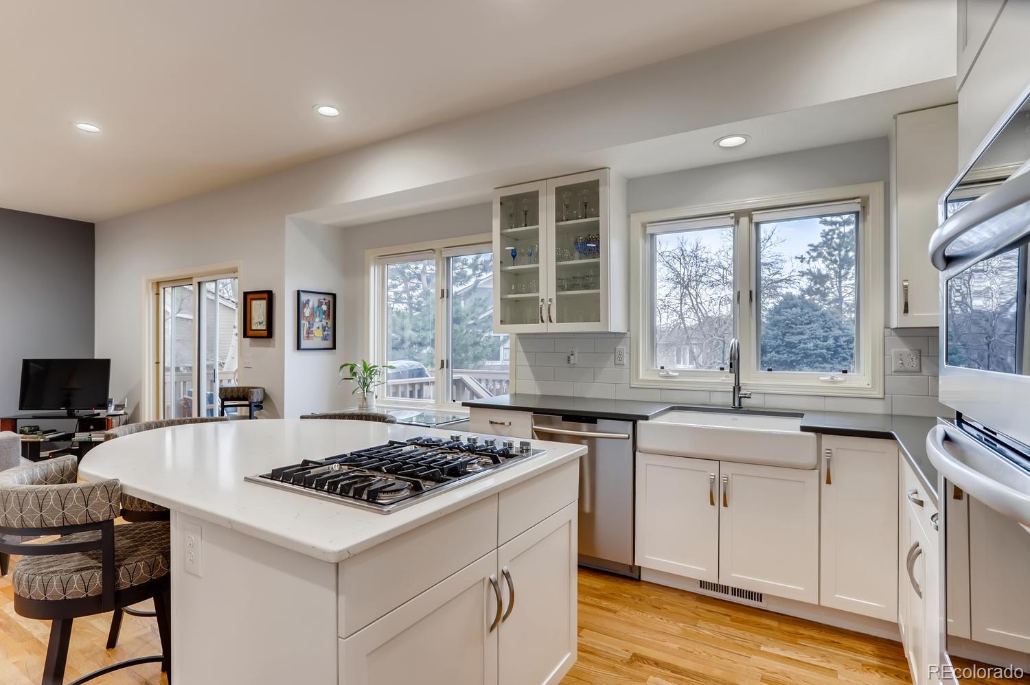 1450 Oakleaf Circle Boulder, CO 80304 - Photo 7 of 27 a kitchen with a stove a sink and wooden floor