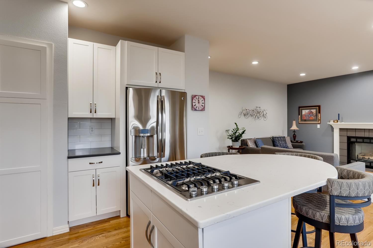 1450 Oakleaf Circle Boulder, CO 80304 - Photo 9 of 27 a kitchen with granite countertop a sink stove and refrigerator