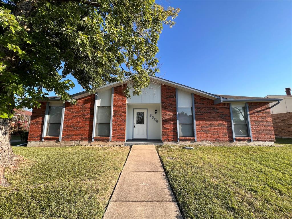 8506 Woodside Road Rowlett, TX 75088 - Photo 25 of 25 a front view of house with yard