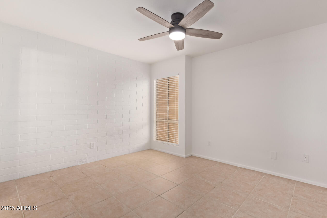 1701 West Tuckey Lane, Unit 231 Phoenix, AZ 85015 - Photo 15 of 17 a view of an empty room with a window