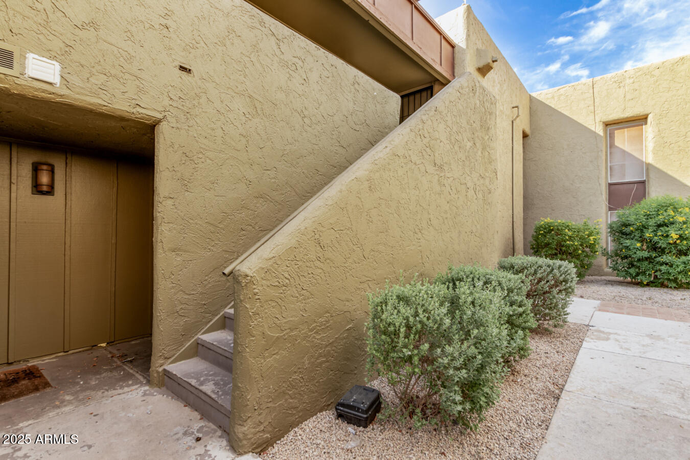 1701 West Tuckey Lane, Unit 231 Phoenix, AZ 85015 - Photo 4 of 17 a view of a pathway of a building