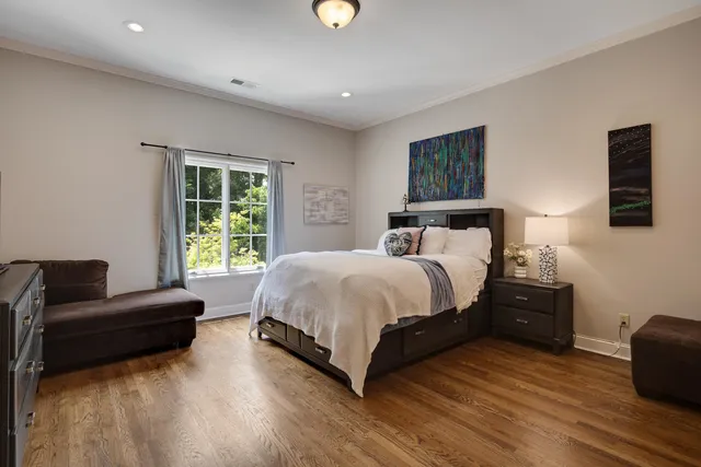 a spacious bedroom with a bed and a couch