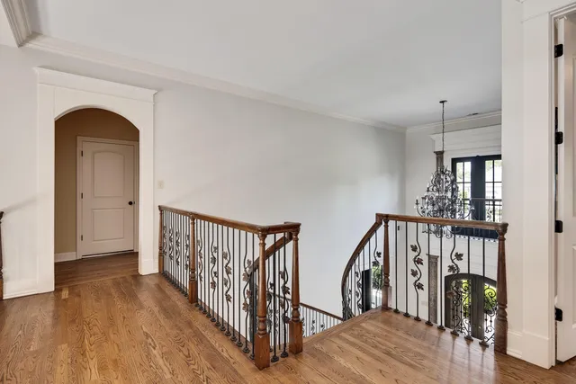 a view of entryway with wooden floor and windows