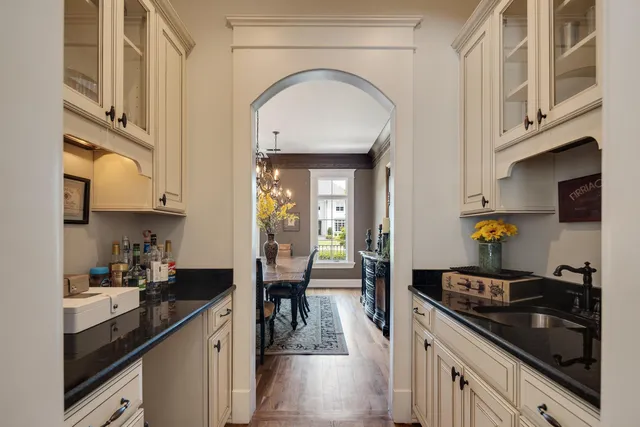 a kitchen with stainless steel appliances a sink a stove and cabinets
