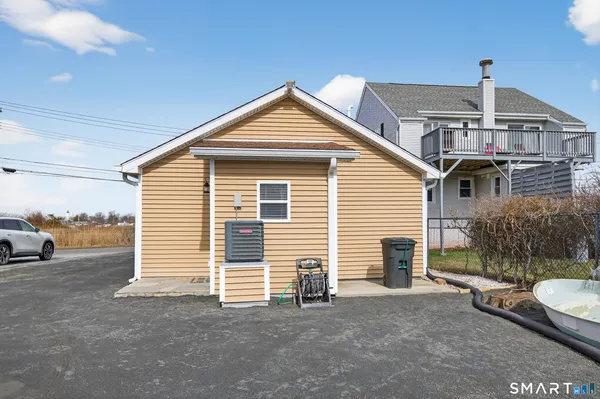 a view of a car park in front of house