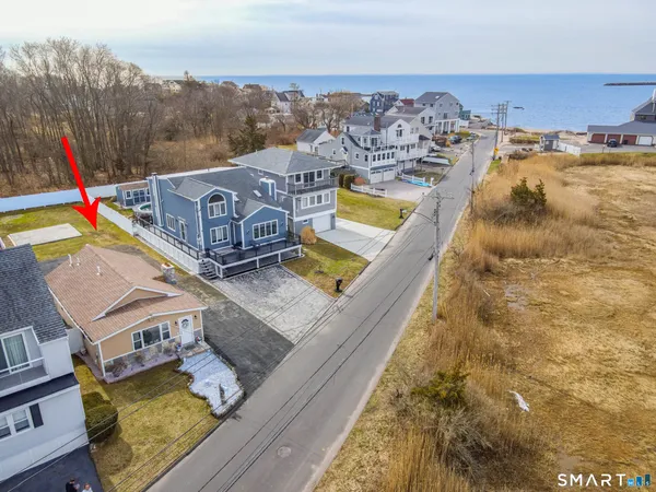 a front view of house with yard and outdoor seating