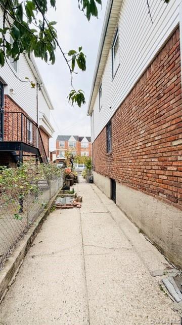 143-15 22nd Road Queens, NY 11357 - Photo 13 of 16 a view of a pathway with a yard