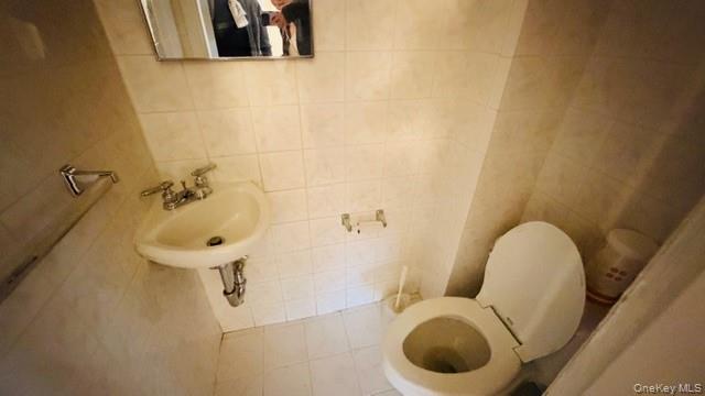 143-15 22nd Road Queens, NY 11357 - Photo 15 of 16 a bathroom with a sink toilet and shower