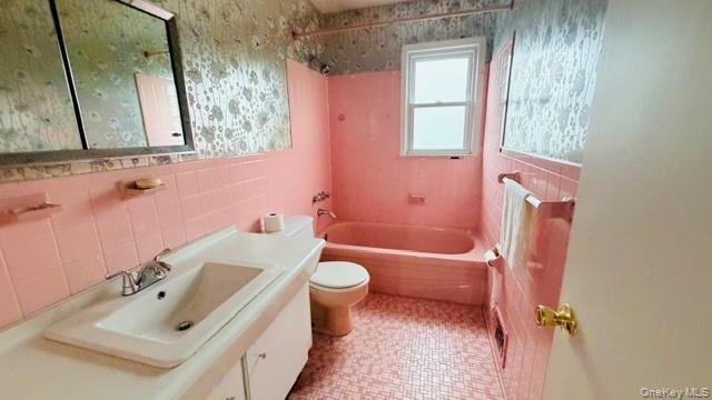 143-15 22nd Road Queens, NY 11357 - Photo 16 of 16 a bathroom with a sink toilet and shower