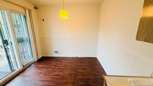 143-15 22nd Road Queens, NY 11357 - Photo 5 of 16 a view of a room with wooden floor and a window