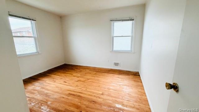 143-15 22nd Road Queens, NY 11357 - Photo 7 of 16 an empty room with a window