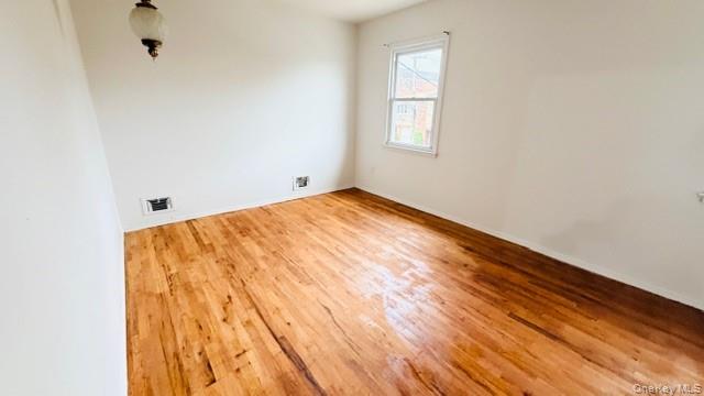 143-15 22nd Road Queens, NY 11357 - Photo 8 of 16 a view of room with wooden floor and fan