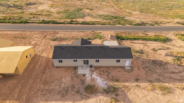 130 Pole Line Road, Unit 2 Roosevelt, UT 84066 - Photo 5 of 33 Contemporary single-story residence with a dark shingle roof and light-colored siding