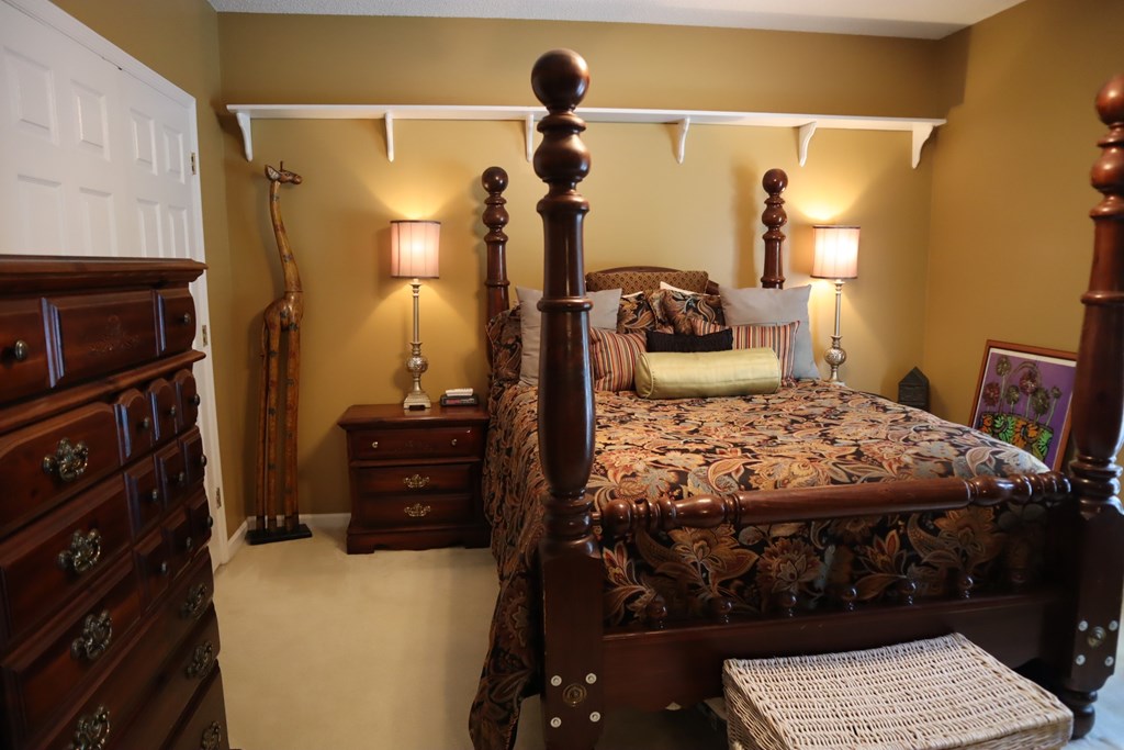 7208 West Wynfield Loop Midland, GA 31820 - Photo 12 of 20 a bedroom with a bed and wooden floor