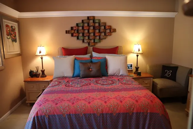 a bedroom with a bed and window