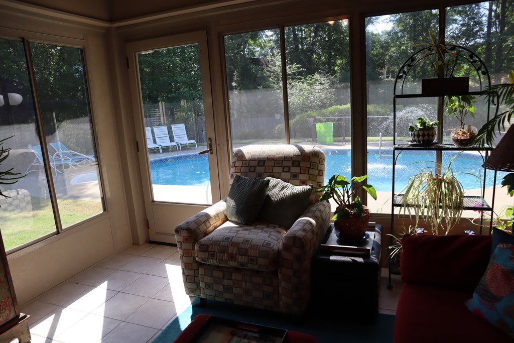 7208 West Wynfield Loop Midland, GA 31820 - Photo 16 of 20 a living room with patio furniture and a floor to ceiling window