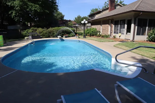 a view of a house with sitting area and yard