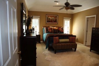 7208 West Wynfield Loop Midland, GA 31820 - Photo 9 of 20 a bedroom with a bed couch and a window