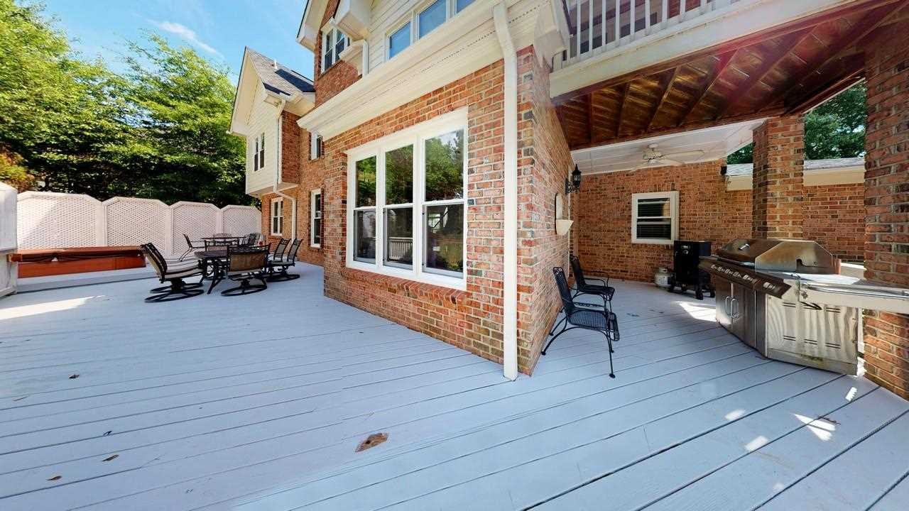 12432 Canolder Street Raleigh, NC 27614 - Photo 29 of 30 Large deck with hot tub and grilling area. Patio/Deck