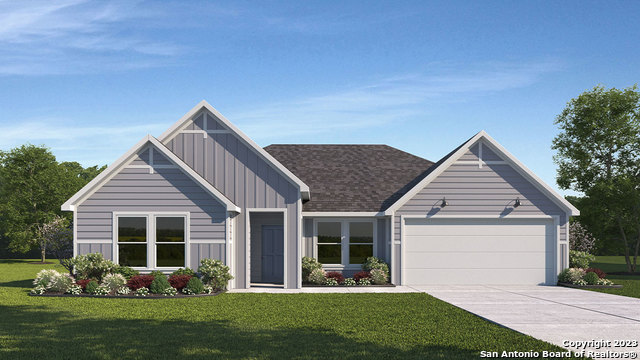 a front view of house with yard and green space