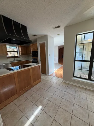 a view of kitchen with furniture and window