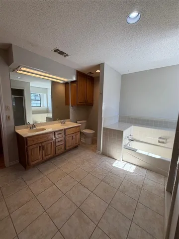a bathroom with a sink a mirror and a toilet