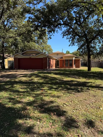 a view of a house with a big yard