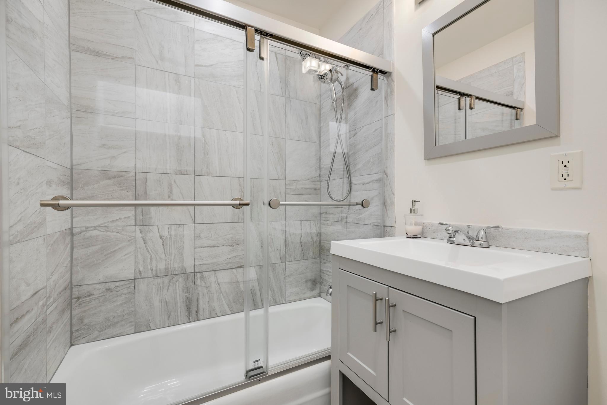 2179 White Cornus Lane Reston, VA 20191 - Photo 19 of 27 a bathroom with a sink and a mirror