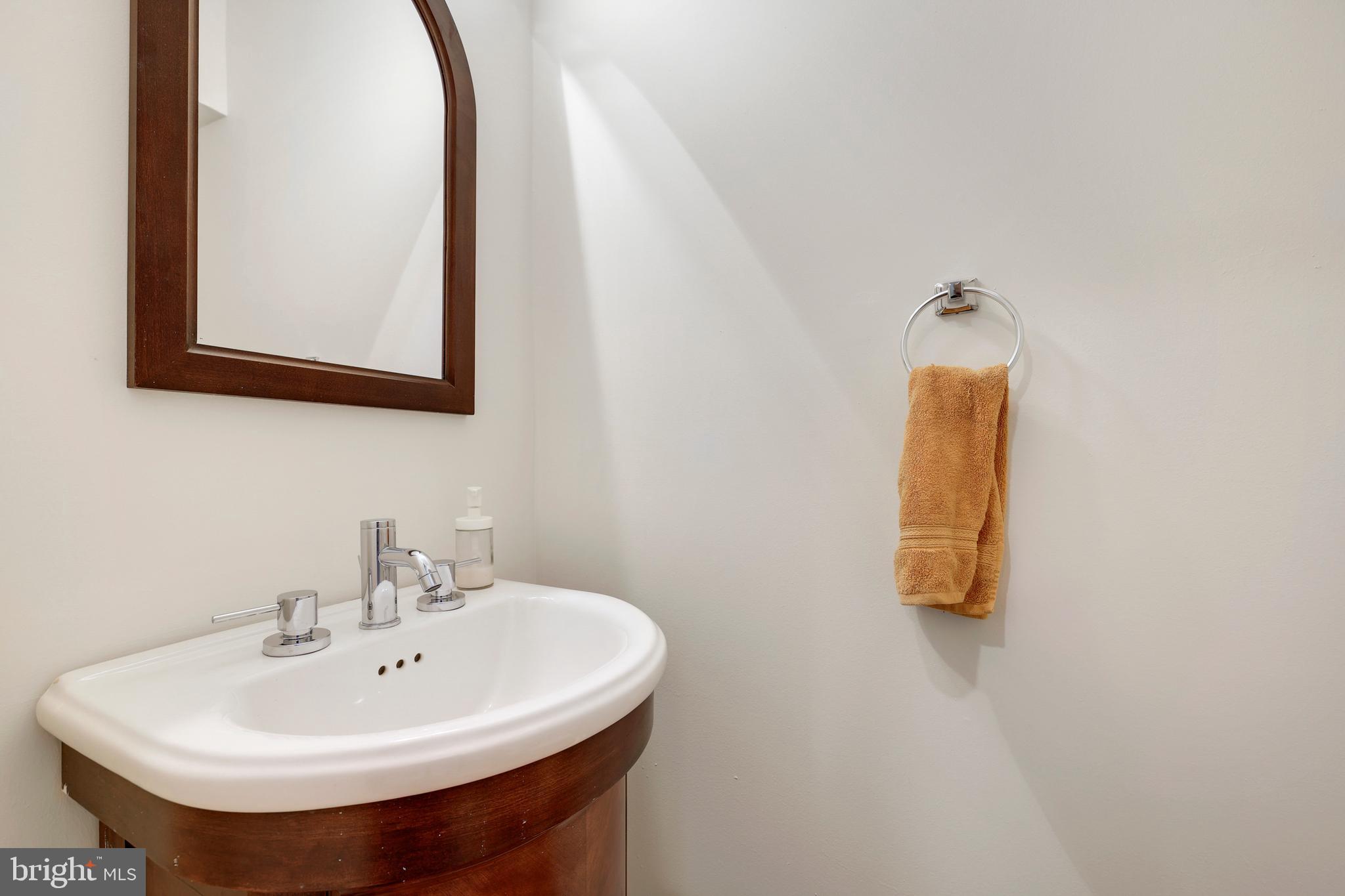 2179 White Cornus Lane Reston, VA 20191 - Photo 20 of 27 a bathroom with a sink and a mirror