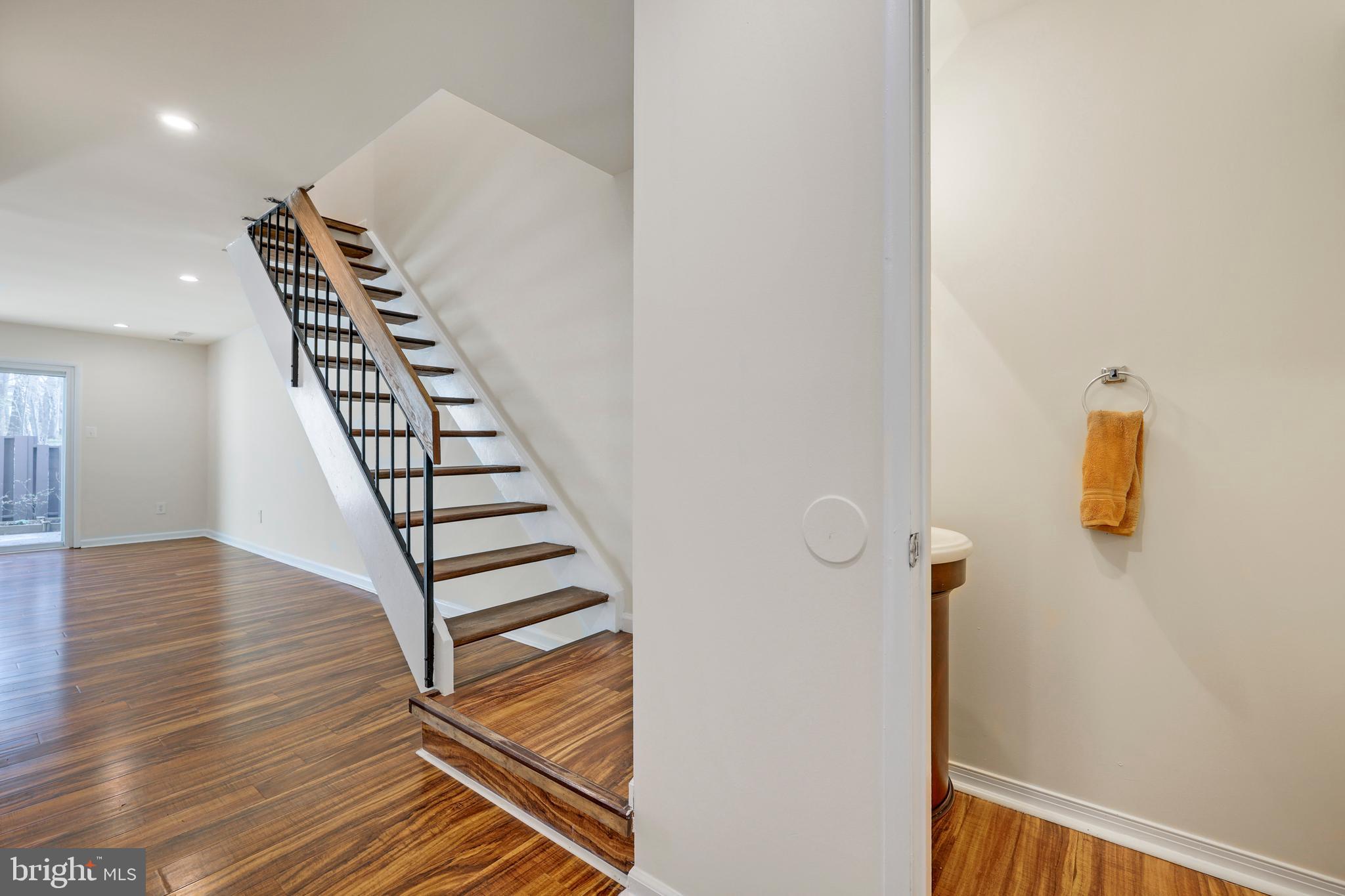 2179 White Cornus Lane Reston, VA 20191 - Photo 6 of 27 a view of a room with wooden floor and stairs