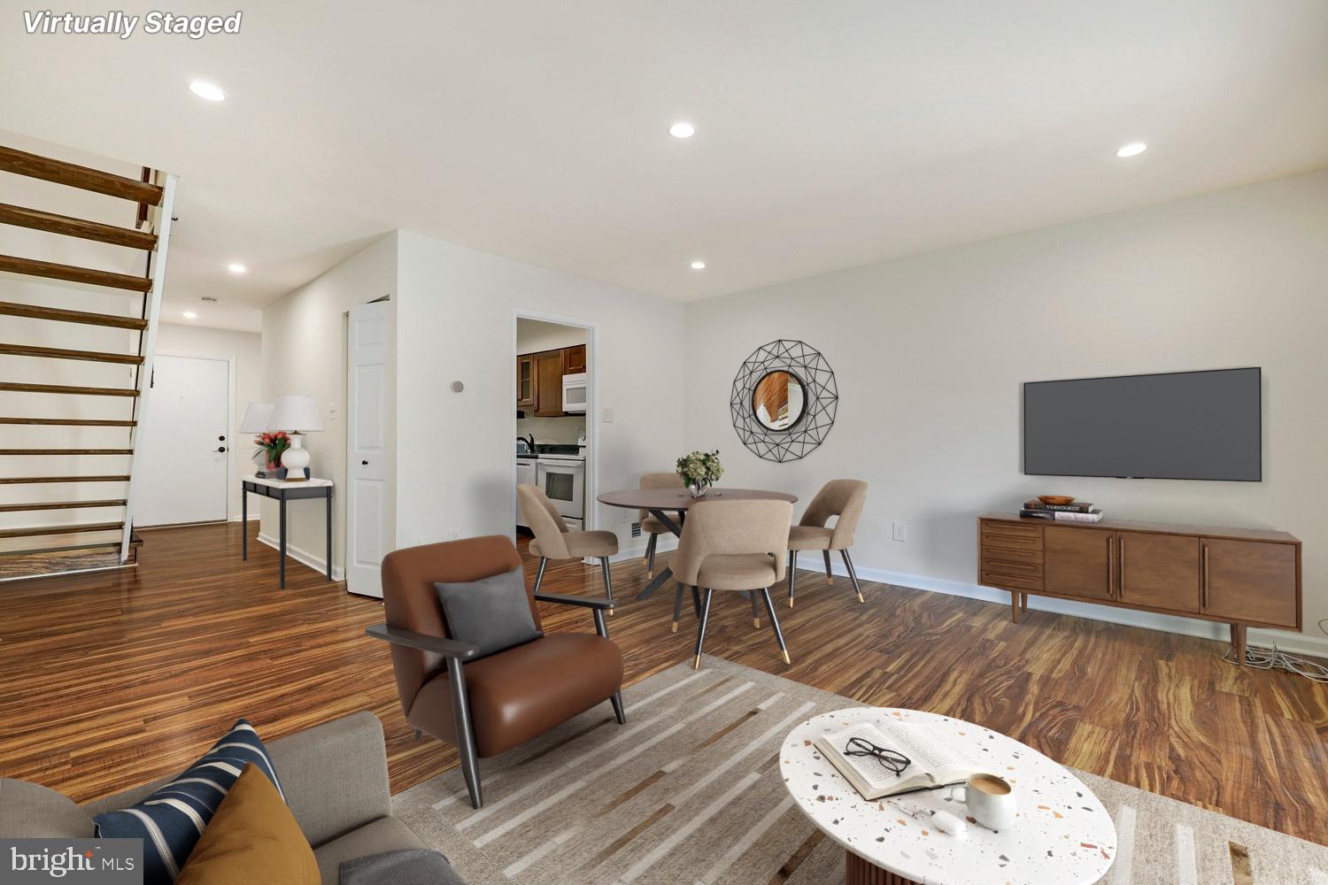 2179 White Cornus Lane Reston, VA 20191 - Photo 7 of 27 a living room with furniture and a flat screen tv