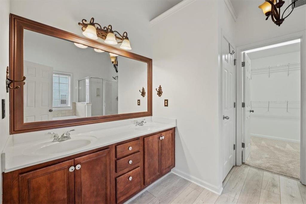 1218 Morgans Run Monroe, GA 30656 - Photo 16 of 39 a spacious bathroom with a sink mirror and a shower