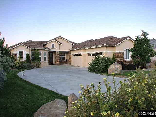 5232 North Elk River Road Reno, NV 89511 - Photo 1 of 9 a front view of a house with yard and green space