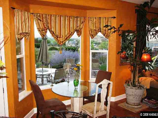 5232 North Elk River Road Reno, NV 89511 - Photo 4 of 9 a dining room filled with furniture and a potted plant