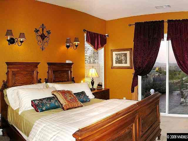 5232 North Elk River Road Reno, NV 89511 - Photo 5 of 9 a bedroom with a bed and wooden floor