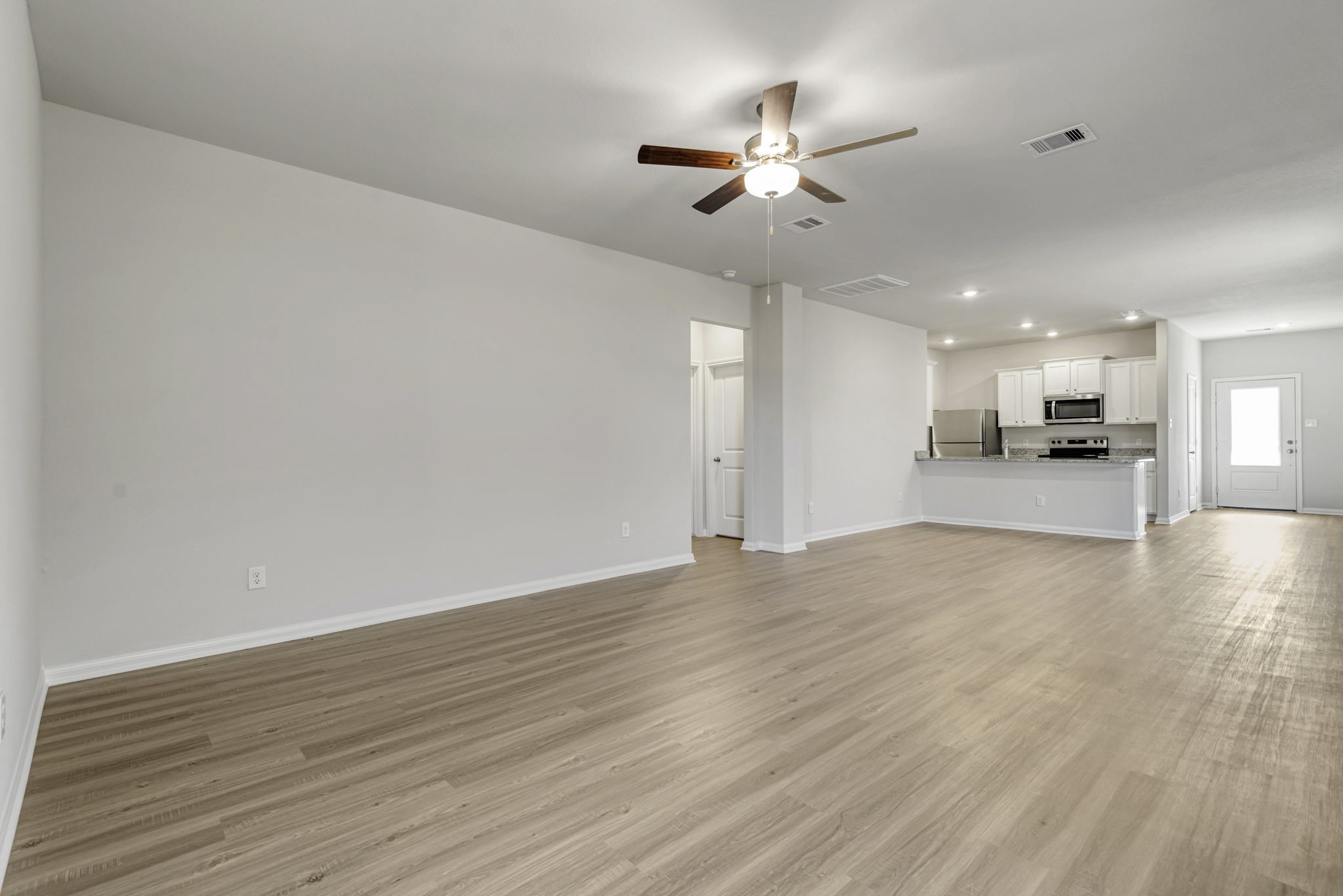 6414 Winter Elm Street Houston, TX 77048 - Photo 2 of 7 The open concept in the living room offers plenty of space to gather with your family and friends.