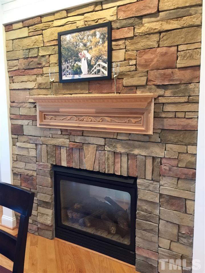 1024 Stone Eagle Lane Raleigh, NC 27610 - Photo 14 of 25 Two-sided Fireplace - Kitchen Area