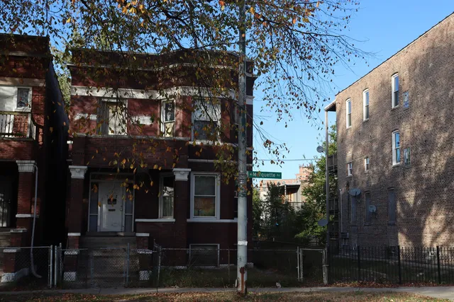 a front view of a building with a street