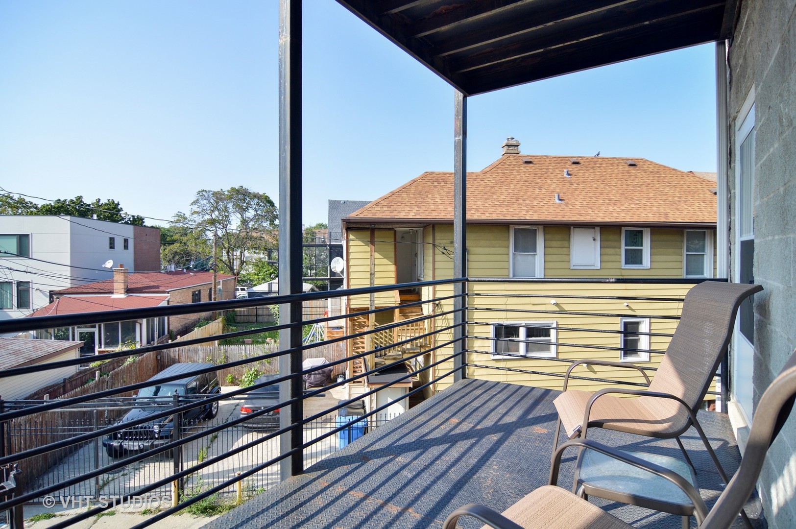 2940 North Spaulding Avenue, Unit 2N Chicago, IL 60618 - Photo 4 of 4 a front view of a house with a balcony