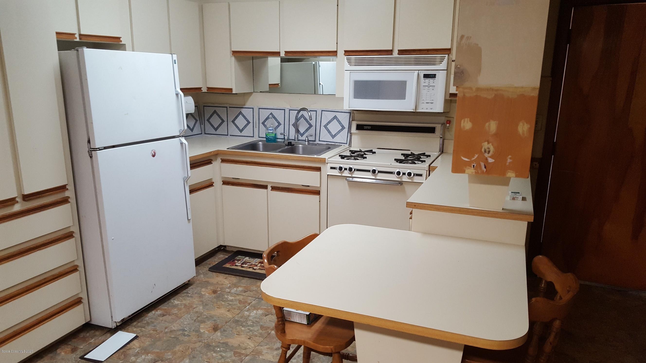 3313 Barton Street Mims, FL 32754 - Photo 3 of 14 3313 Kitchen with Microwave