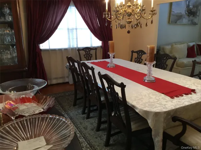 a view of a dining room with furniture and window