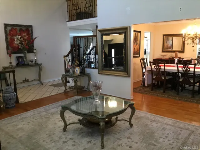 a living room with furniture a rug and a large window