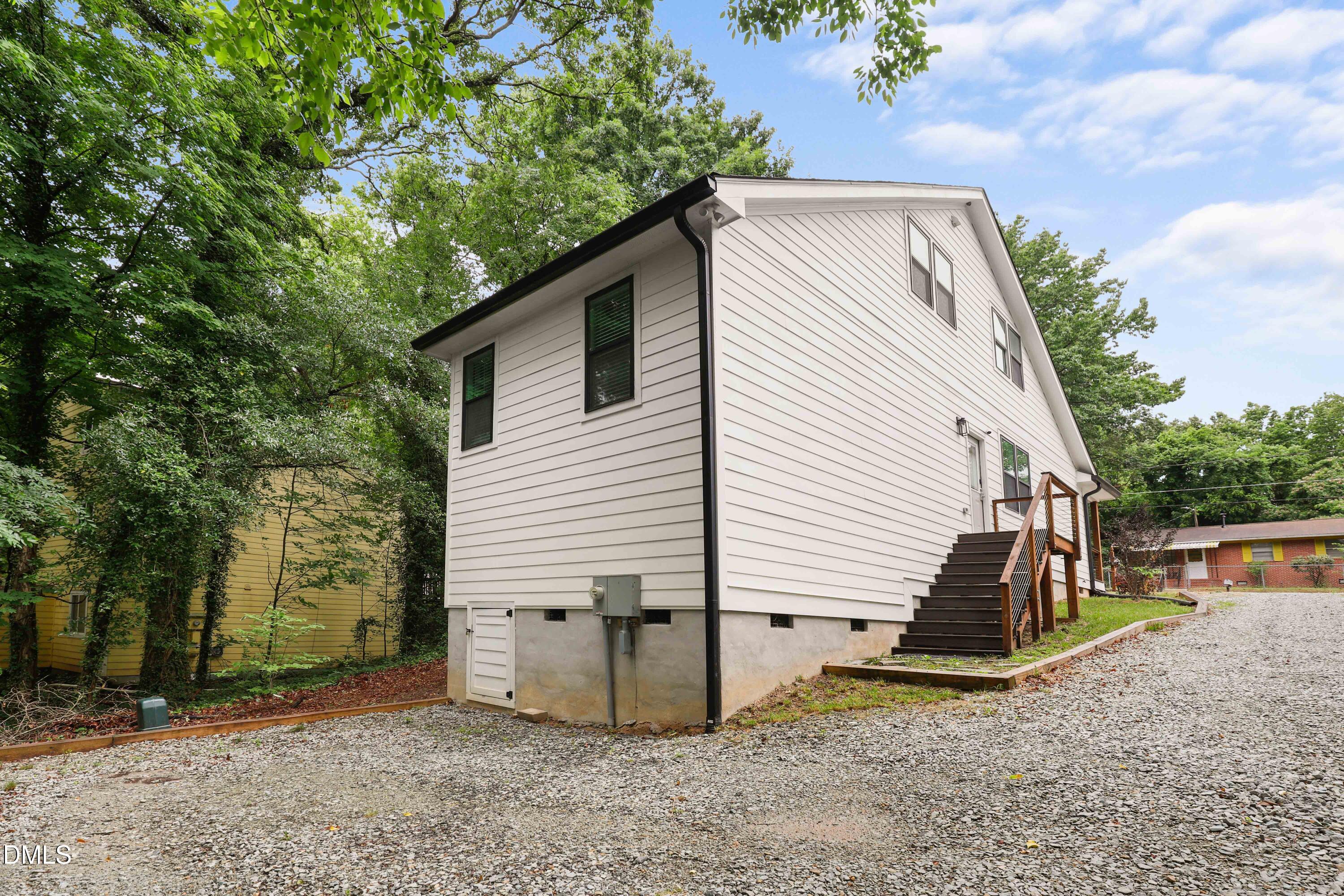 1217 Rosedale Avenue, Unit B Durham, NC 27707 - Photo 20 of 24 a view of a house with a yard and garage