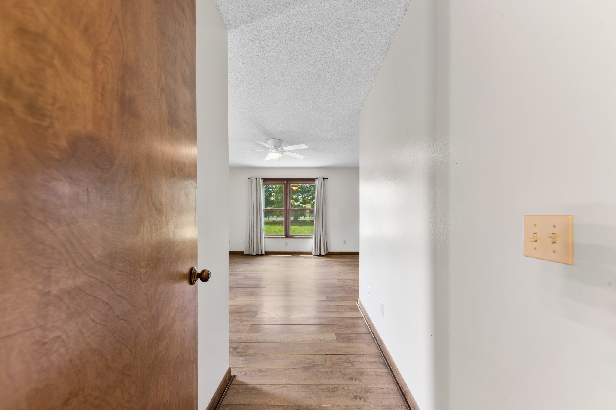 239 Henry Bayless Road Ardmore, TN 38449 - Photo 36 of 82 a view of a hallway with wooden walls