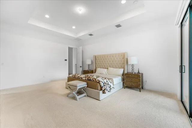 a bedroom with a bed and a chair