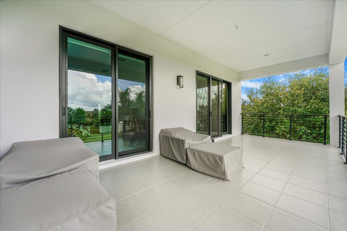 9093 Chauvet Way Boca Raton, FL 33496 - Photo 18 of 31 a living room with furniture and large windows