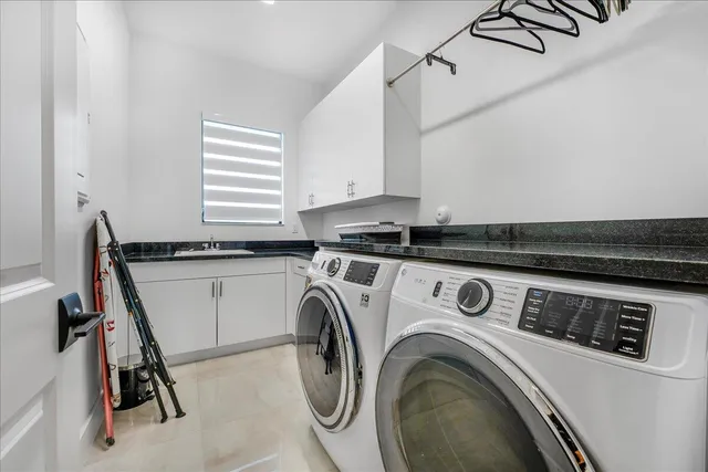a utility room with dryer and washer