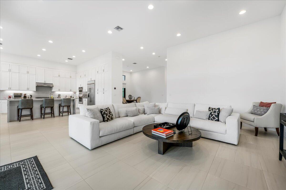 9093 Chauvet Way Boca Raton, FL 33496 - Photo 8 of 31 a living room with furniture and kitchen view